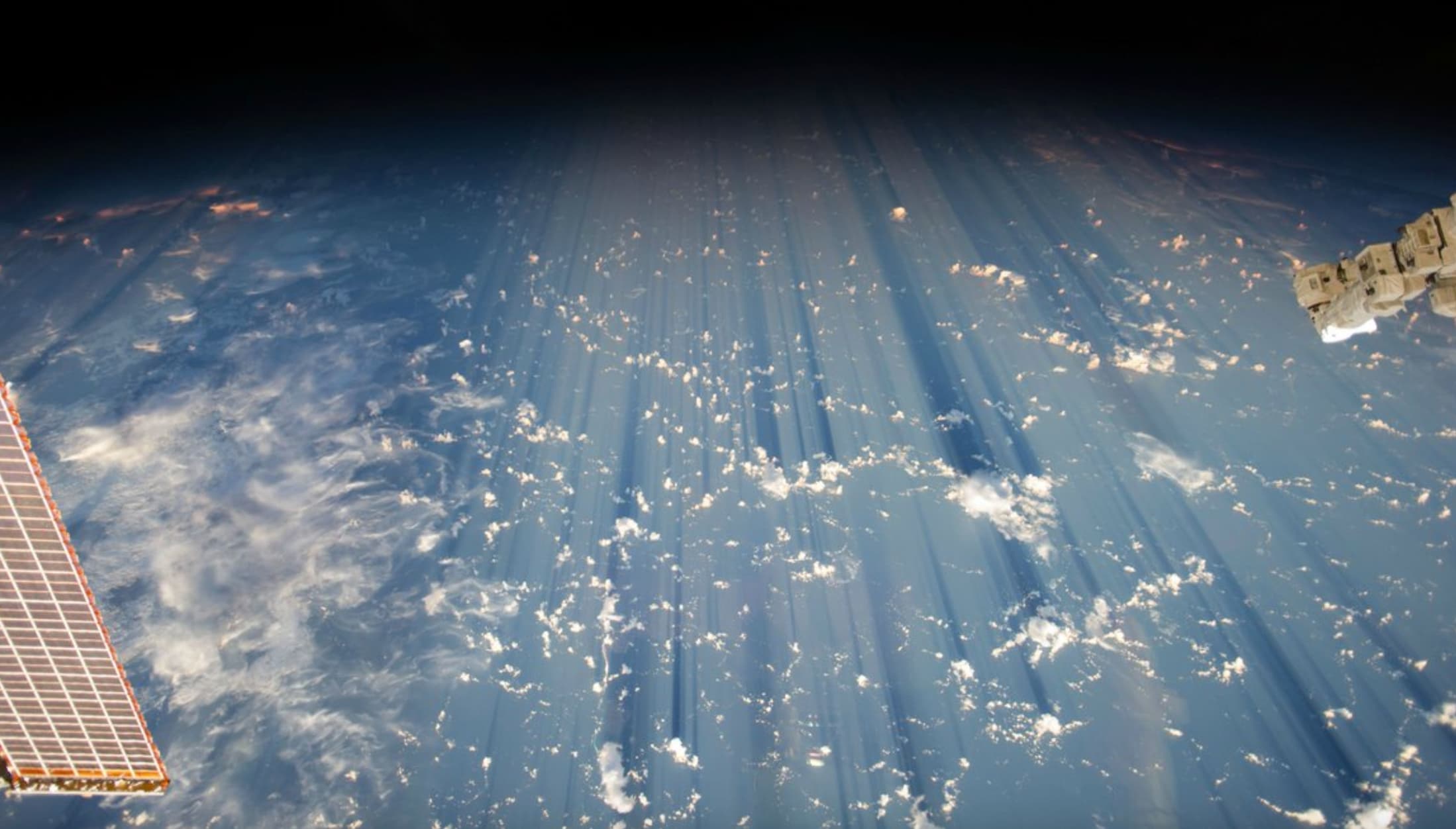 “Clouds casting thousand-mile shadows when viewed from the ISS.”